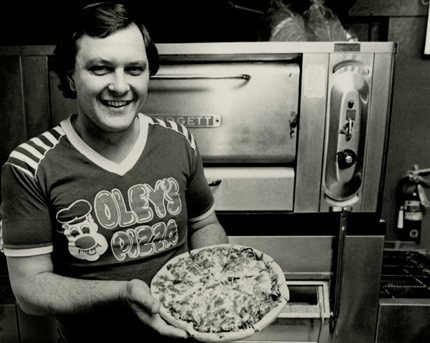 Oley Olinger with a fresh pizza