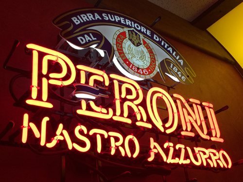 A Peroni neon sign in the bar